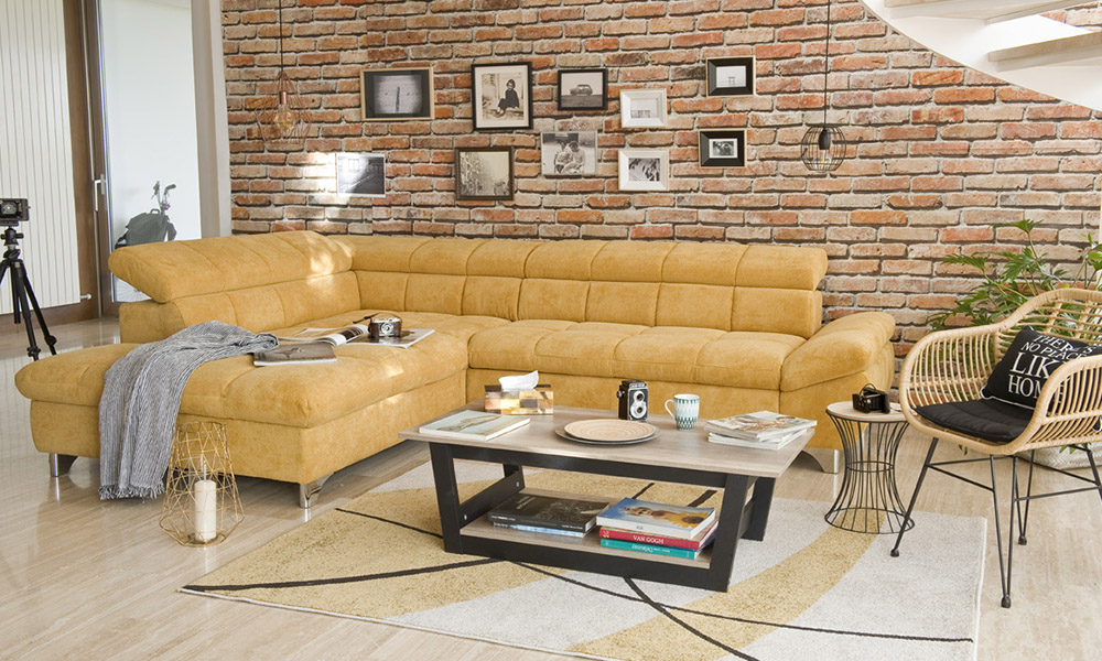 Fular plaid multiusos RAYAS en gris claro sobre sofa rinconera GÉMINIS Fular plaid multiusos RAYAS en gris claro sobre sofa rinconera GÉMINIS